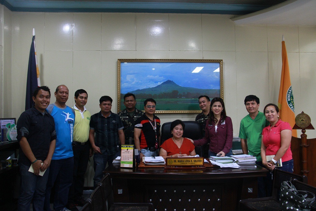 Ms. Jing Castañeda (3rd from right) together     with Dr. Maria Luisa R. Soliven, University President and some CMU officials     and representatives from the 4th Civil Military Operations Battalion 4ID     headed by Lt. Col Eugenio Julio Osias